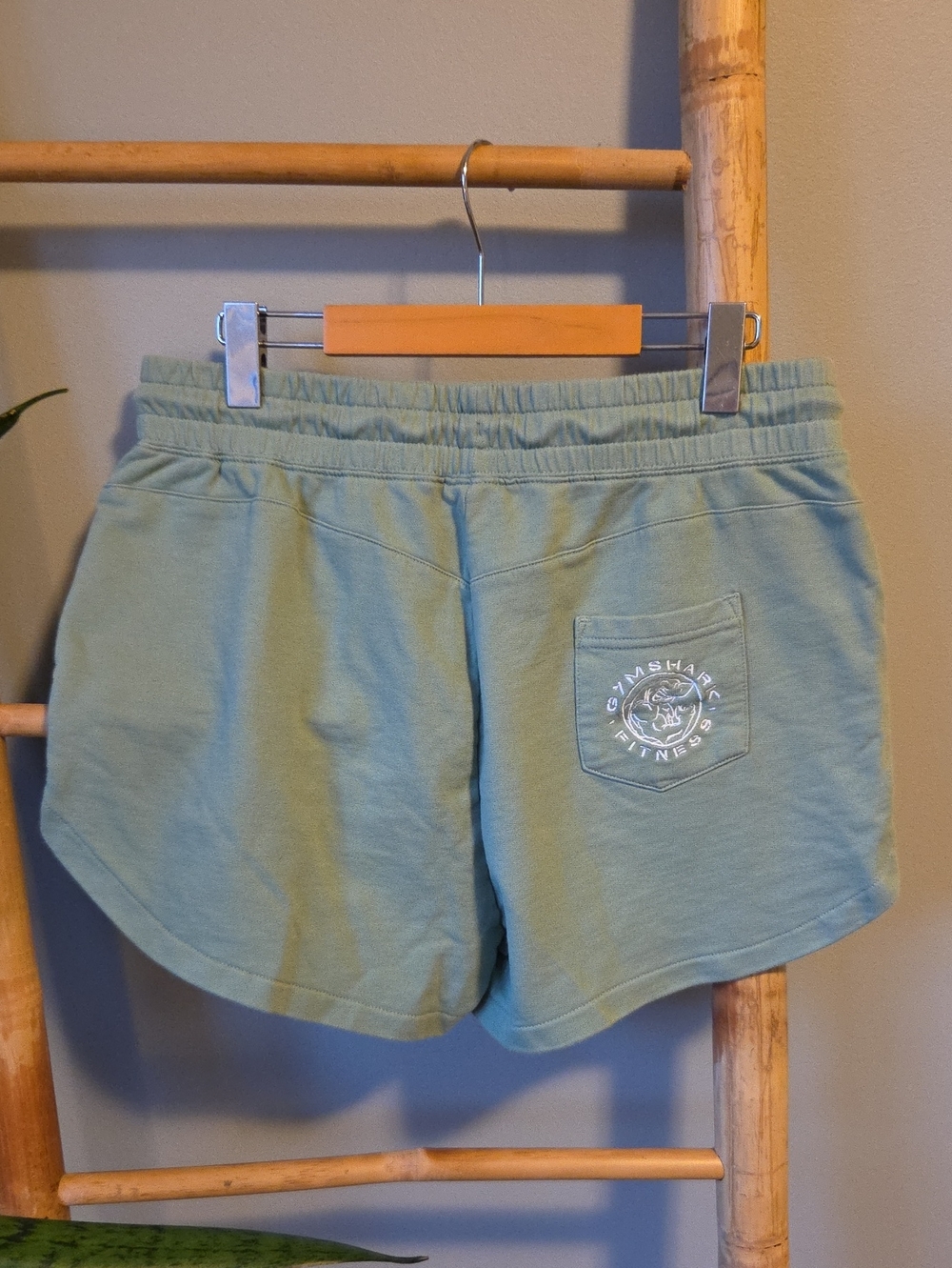 Gymshark Women's Sage Green Athletic Shorts with Logo Pocket